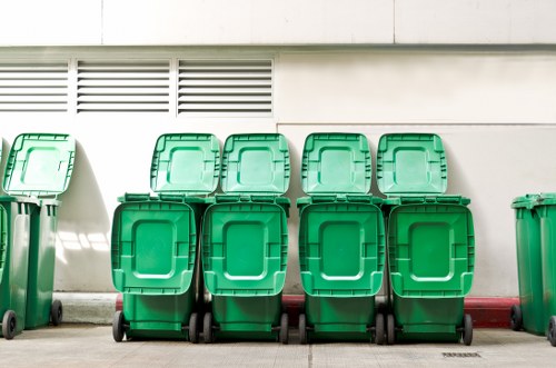 Residents disposing of waste in designated bins